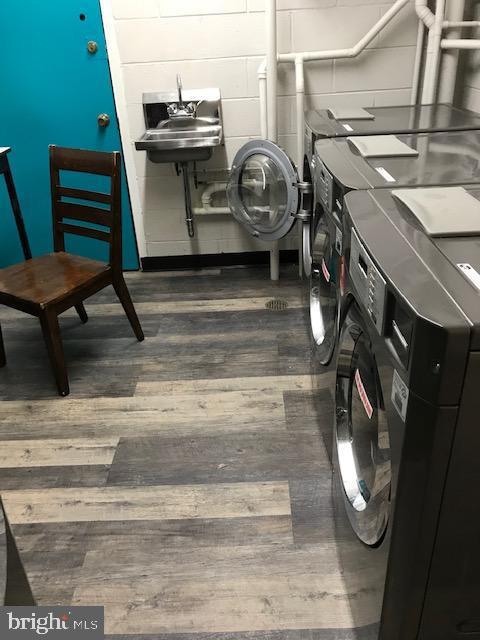 401 Cooper Landing Rd Unit 207Playa, Del Sol, Cherry Hill, NJ 08002 - washroom featuring wood finished floors and separate washer and dryer