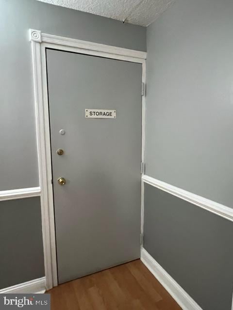 401 Cooper Landing Rd Unit 207Playa, Del Sol, Cherry Hill, NJ 08002 - doorway with wood finished floors and a textured ceiling