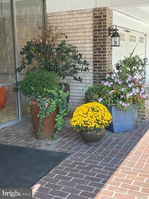 401 Cooper Landing Rd Unit 207Playa, Del Sol, Cherry Hill, NJ 08002 - view of exterior entry with brick siding