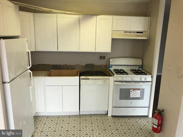 401 Cooper Landing Rd Unit 207Playa, Del Sol, Cherry Hill, NJ 08002 - kitchen featuring white appliances, under cabinet range hood, white cabinets, and light floors