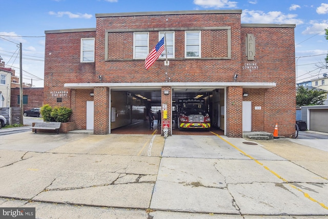 2451 Midtown Ave Unit 1323, Alexandria, VA 22303 - view of property featuring concrete driveway and a garage