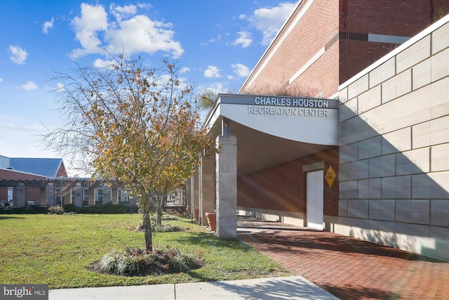 2451 Midtown Ave Unit 1323, Alexandria, VA 22303 - view of property exterior featuring brick siding and a yard
