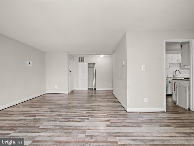 3316 Huntley Square Dr Unit A1, Temple Hills, MD 20748 - unfurnished living room with light wood-style flooring and baseboards