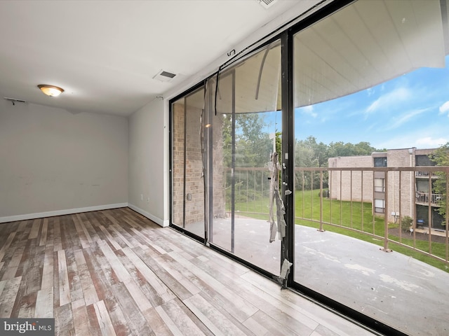 3316 Huntley Square Dr Unit A1, Temple Hills, MD 20748 - spare room featuring floor to ceiling windows and wood finished floors