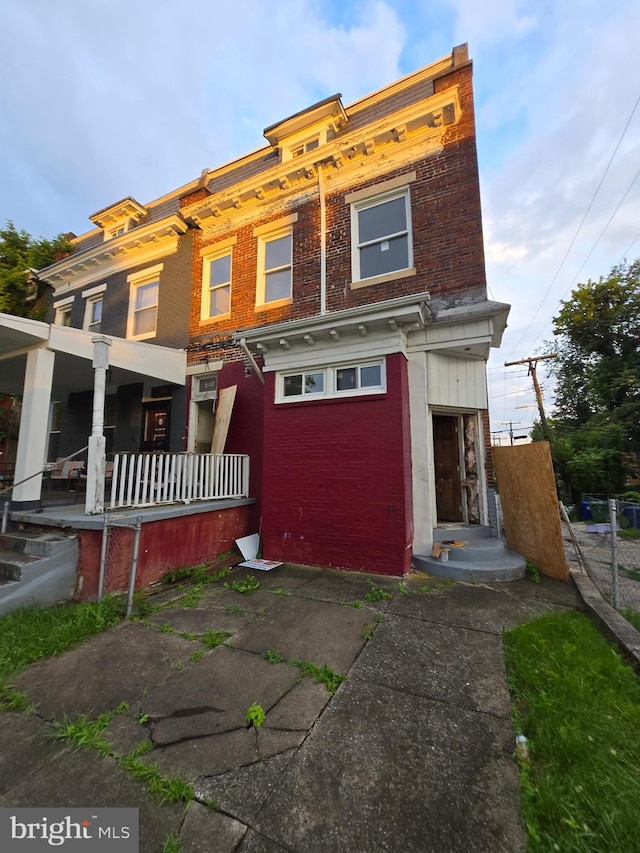 2617 Shirley Ave, Baltimore, MD 21215 - view of front of house with brick siding and a porch