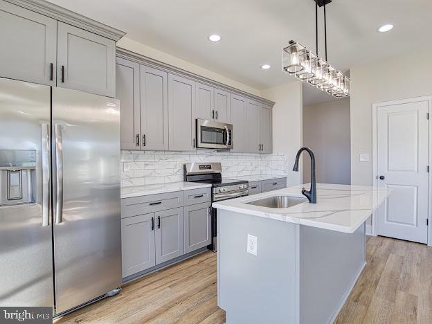 103 Woodland Dr, Montross, VA 22520 - kitchen featuring stainless steel appliances, gray cabinets, light wood finished floors, and recessed lighting