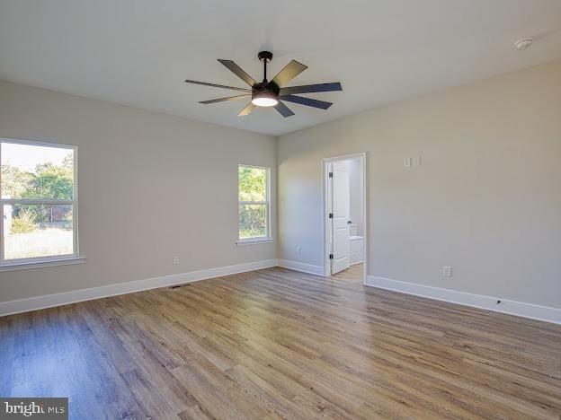 103 Woodland Dr, Montross, VA 22520 - spare room featuring light wood-type flooring, a ceiling fan, and a smoke detector