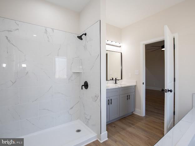 103 Woodland Dr, Montross, VA 22520 - full bath with a shower, vanity, and wood finished floors