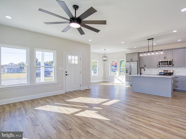 103 Woodland Dr, Montross, VA 22520 - kitchen with appliances with stainless steel finishes, gray cabinets, light wood finished floors, light countertops, and recessed lighting