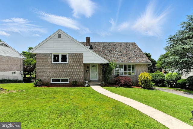 312 Wellington, Reading, PA 19609 - view of front of home featuring a chimney, a front lawn, and brick siding