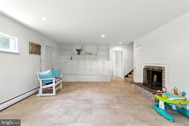 312 Wellington, Reading, PA 19609 - living area featuring an AC wall unit, a brick fireplace, recessed lighting, and stairs