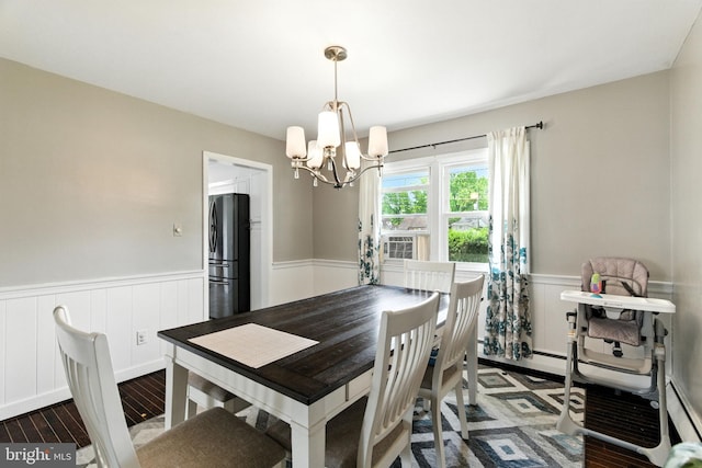 312 Wellington, Reading, PA 19609 - dining space with a chandelier, a wainscoted wall, and wood finished floors