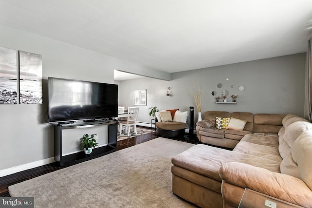 312 Wellington, Reading, PA 19609 - living area featuring wood finished floors and a baseboard radiator