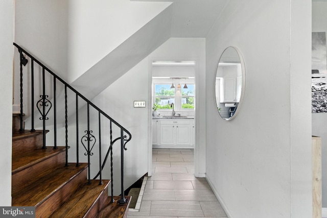 312 Wellington, Reading, PA 19609 - staircase featuring tile patterned flooring and baseboards