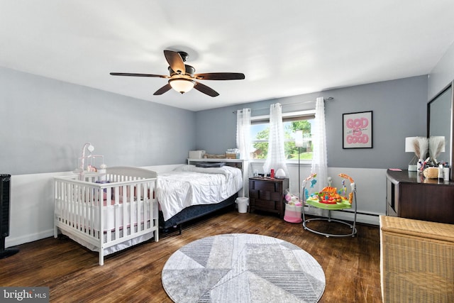 312 Wellington, Reading, PA 19609 - bedroom featuring a baseboard heating unit, wood finished floors, and a ceiling fan
