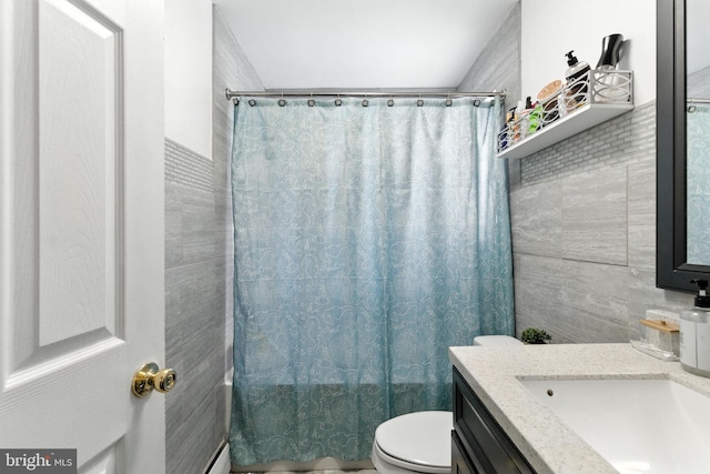 312 Wellington, Reading, PA 19609 - bathroom featuring vanity, tile walls, and shower / bathtub combination with curtain