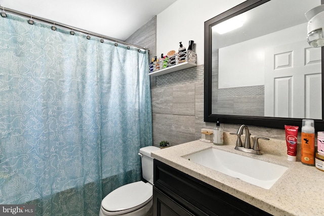 312 Wellington, Reading, PA 19609 - bathroom featuring tile walls, vanity, and tasteful backsplash
