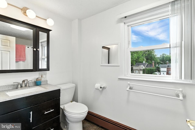 312 Wellington, Reading, PA 19609 - full bathroom featuring vanity, baseboard heating, and a textured ceiling