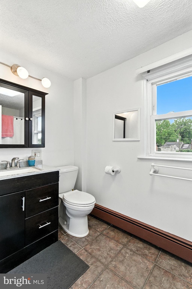 312 Wellington, Reading, PA 19609 - bathroom with a baseboard radiator, vanity, and a textured ceiling