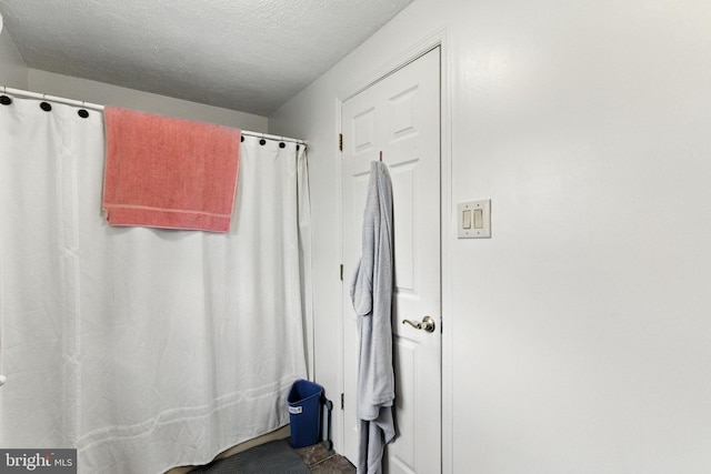 312 Wellington, Reading, PA 19609 - bathroom with a textured ceiling and curtained shower
