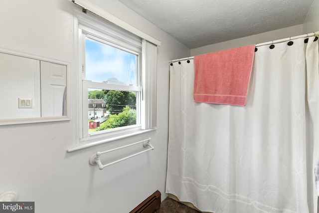 312 Wellington, Reading, PA 19609 - full bath with curtained shower and a textured ceiling