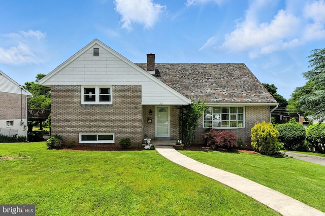 312 Wellington, Reading, PA 19609 - view of front of home with a front lawn, brick siding, and a chimney