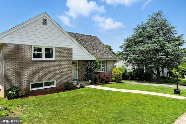 312 Wellington, Reading, PA 19609 - view of front facade featuring brick siding and a front yard