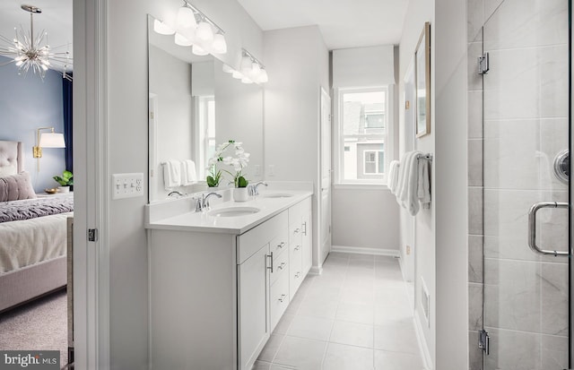 3929 Walnut St, Fairfax, VA 22030 - full bathroom with connected bathroom, double vanity, tile patterned floors, and a shower stall