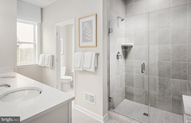 3929 Walnut St, Fairfax, VA 22030 - bathroom featuring a shower stall, double vanity, and tile patterned floors
