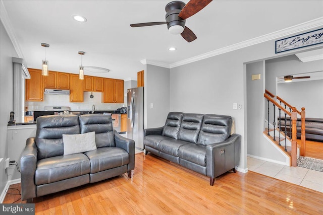 4002 Grenwich Ln, Mount Laurel, NJ 08054 - living area with a ceiling fan, crown molding, stairs, light wood-type flooring, and recessed lighting