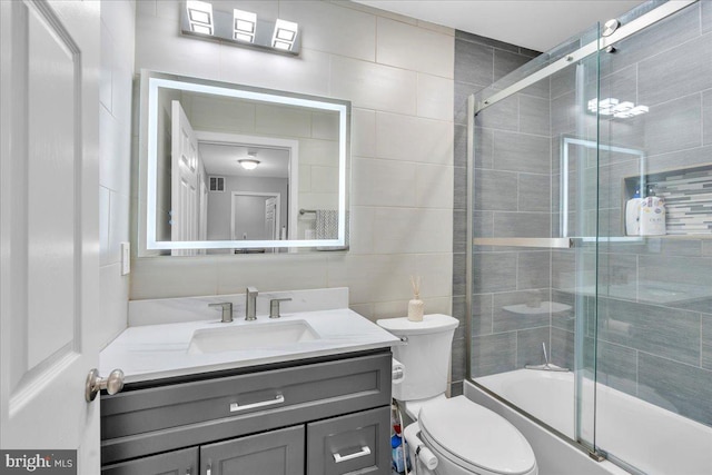 4002 Grenwich Ln, Mount Laurel, NJ 08054 - bathroom with tile walls, vanity, and bath / shower combo with glass door