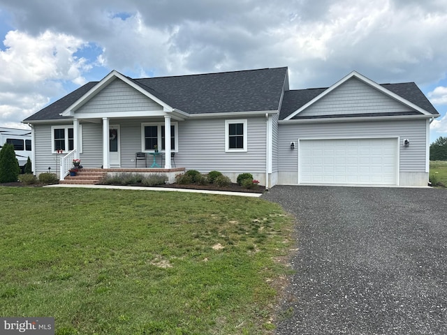 6236 Solomons Cir, Hurlock, MD 21643 - view of front of home with a porch, an attached garage, a front lawn, asphalt driveway, and a shingled roof
