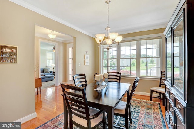 134 Woodhaven Dr, Gettysburg, PA 17325 - dining space with light wood finished floors, a chandelier, and ornamental molding