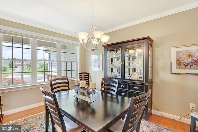 134 Woodhaven Dr, Gettysburg, PA 17325 - dining room with a chandelier, light wood-style flooring, and crown molding