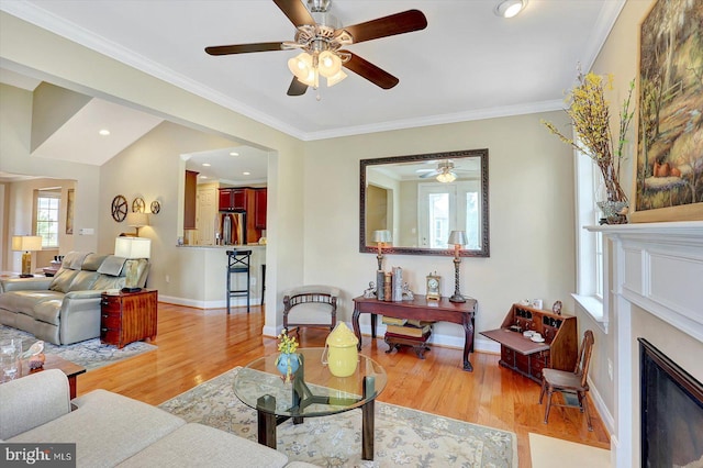 134 Woodhaven Dr, Gettysburg, PA 17325 - living area with a ceiling fan, light wood finished floors, ornamental molding, and a fireplace