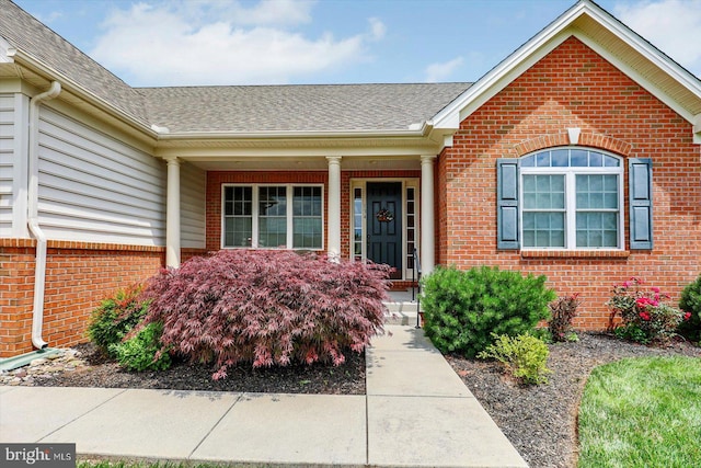 134 Woodhaven Dr, Gettysburg, PA 17325 - property entrance with brick siding, roof with shingles, and a porch