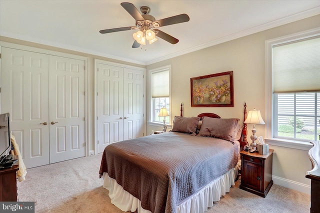 134 Woodhaven Dr, Gettysburg, PA 17325 - bedroom featuring light carpet, two closets, ceiling fan, and crown molding