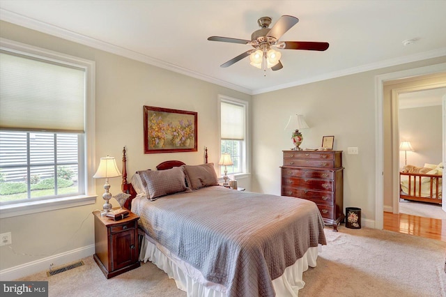 134 Woodhaven Dr, Gettysburg, PA 17325 - bedroom featuring light carpet, ornamental molding, and ceiling fan