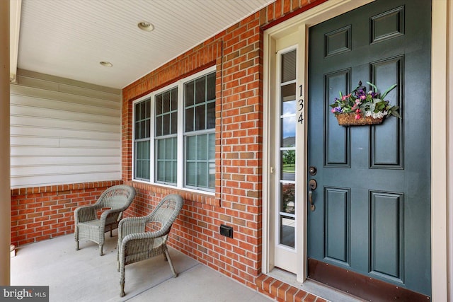 134 Woodhaven Dr, Gettysburg, PA 17325 - property entrance featuring a porch and brick siding
