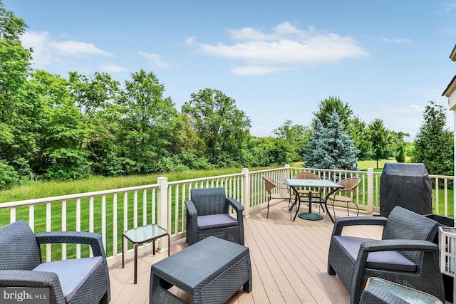 134 Woodhaven Dr, Gettysburg, PA 17325 - wooden deck with outdoor dining area, a lawn, and view of scattered trees
