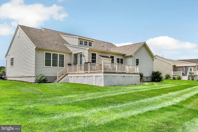 134 Woodhaven Dr, Gettysburg, PA 17325 - back of property featuring a deck, a shingled roof, and a lawn