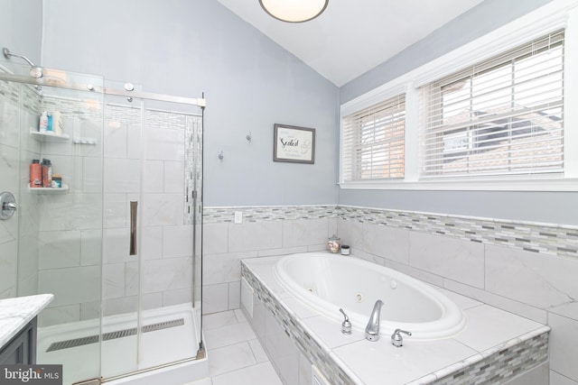 319 E Atlantic Ave, Haddon Heights, NJ 08035 - full bathroom featuring lofted ceiling, a whirlpool tub, a stall shower, tile patterned flooring, and vanity