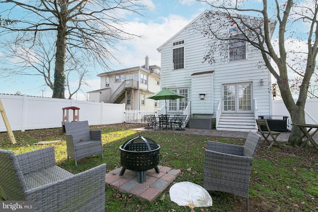319 E Atlantic Ave, Haddon Heights, NJ 08035 - back of property featuring entry steps, an outdoor fire pit, a fenced backyard, and a patio