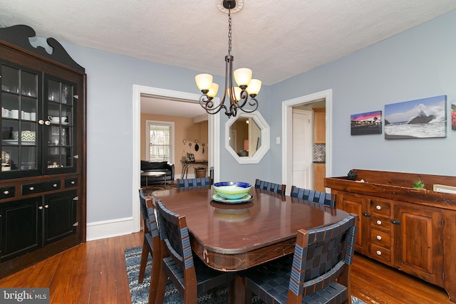 319 E Atlantic Ave, Haddon Heights, NJ 08035 - dining space with a chandelier, wood finished floors, and a textured ceiling