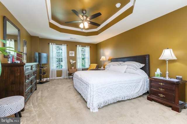 16435 Regatta Ln, Woodbridge, VA 22191 - bedroom featuring light colored carpet, a raised ceiling, crown molding, and ceiling fan