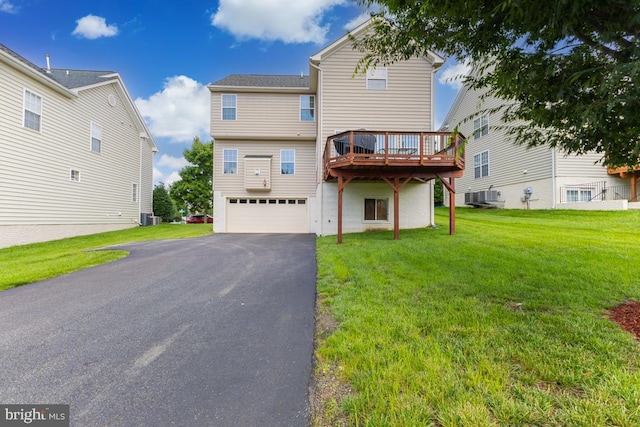 16435 Regatta Ln, Woodbridge, VA 22191 - back of property with an attached garage, a lawn, driveway, and a deck