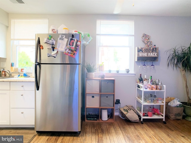304 W Wildey St, Philadelphia, PA 19123 - kitchen featuring freestanding refrigerator, light wood-style floors, white cabinetry, and light countertops
