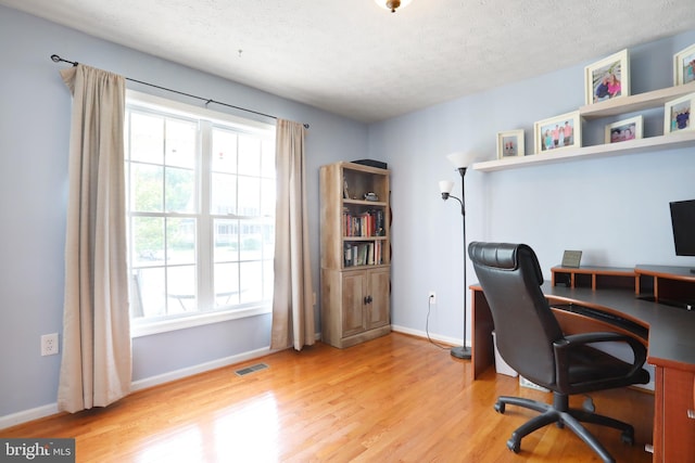 1143 Happy Ridge Dr, Front Royal, VA 22630 - office area featuring wood finished floors and a textured ceiling