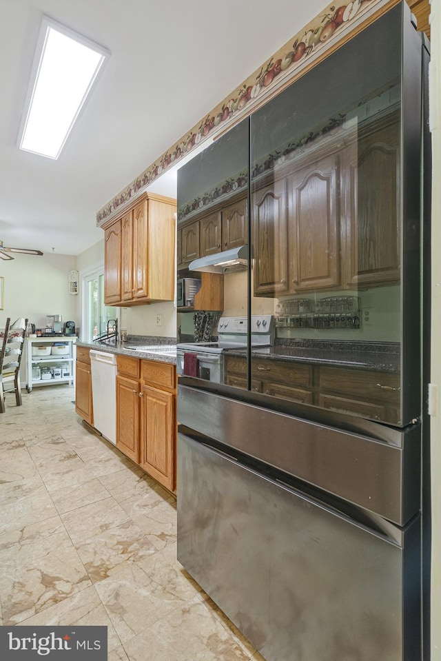 1202 Forestville Dr, Great Falls, VA 22066 - kitchen featuring white appliances, under cabinet range hood, and light marble finish flooring