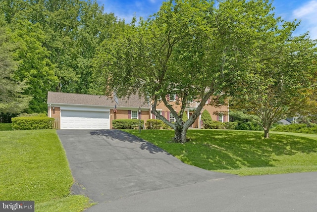 1202 Forestville Dr, Great Falls, VA 22066 - view of front of home with asphalt driveway, an attached garage, and a front lawn